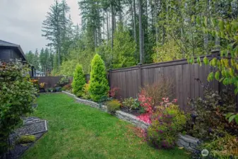 beautifully landscaped backyard.
