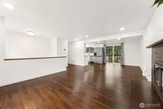 Main living room overlooking kitchen and deck.