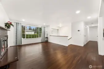 Main living room overlooking hallway holding three bedrooms and a full bathroom.