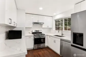 Kitchen with newer appliances and brand new water filtration system.