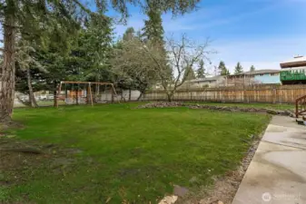 Generous sized almost fully fenced backyard.