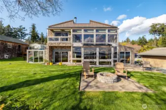 Live large in this 2600 +/- sf custom house on the water...
