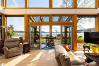 Living room slider opens to sun-room and the great outdoors... Windows equipped with great coverings...