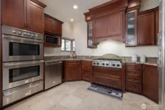 Custom cabinets, tiled floors, great lighting...