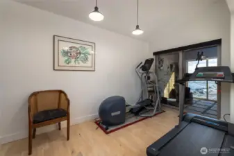 Former dining area turned exercise room.  Covered extra room beyond...