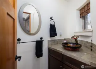 Half bath inside the front door...