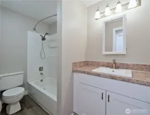 All new bathroom with brand new tub and designer tub  walls