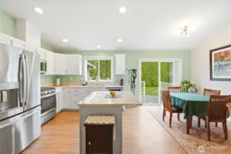Bright kitchen with great connection to the dining area and outdoors.