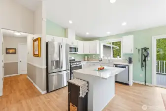 An open kitchen layout with generous counter space and a central island—designed for both cooking and conversation.