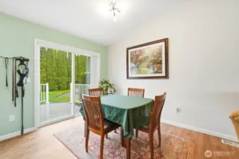 Positioned to take in backyard views, the dining area offers a warm setting for everyday meals and gatherings.