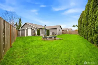 Plenty of room here to garden, relax, or gather, with fencing that helps shape the space and add a sense of calm.