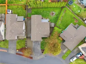 A large yard with mature trees, fully fenced backyard, long driveway with additional side yard parking- it's all there!