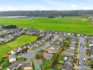 A welcoming neighborhood setting with nearby open space and a sense of room to breathe.