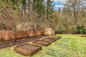 Green house and raised garden beds ready for planting and outdoor enjoyment.