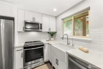 Large window overlooking the expansive backyard lets in tons of natural light.