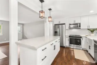 The open concept layout allows you to be a part of the living room action even while in the kitchen!