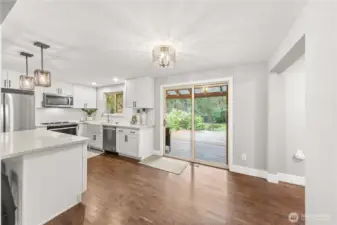 The dining area looks out to the lush backyard.