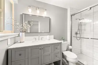 Primary Bathroom: featuring granite countertops and quality craftsmanship tile work.