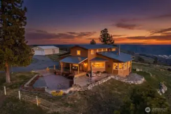 Twilight drone footage of home and surrounding