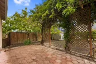 Brick-tile style patio with beautiful flowers