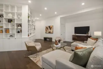 Media room is complete with gorgeous built-ins with storage and design.