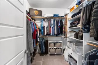 Primary walk in closet with built in storage