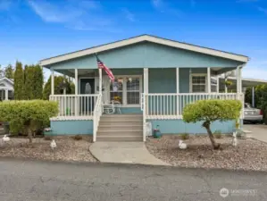 Perfectly Maintained & Beautiful HOME!  Welcoming front covered porch.