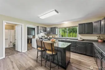 Kitchen with views of 3/4 bath and mud room