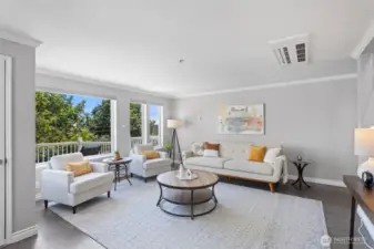 An in-ceiling mini-split for comfort and privacy provided from the street by the large hedges.