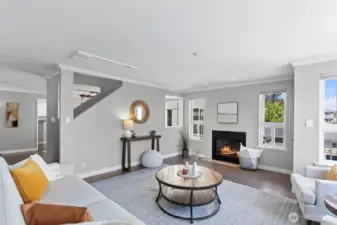 The gas fireplace provides a focal point. This main level has white oak flooring throughout and a pleasant designer wall color.