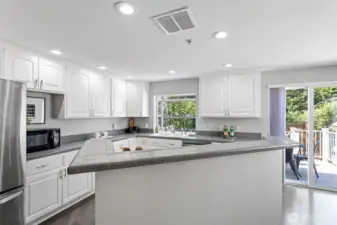 The center island for cooking and add some barstools to entertain the cook!