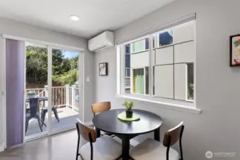 An eat-in kitchen overlooking the back-garden and access to the BBQ deck.