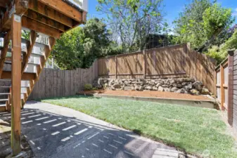 The fully fenced back yard with patio is easy to maintain and pet-friendly.