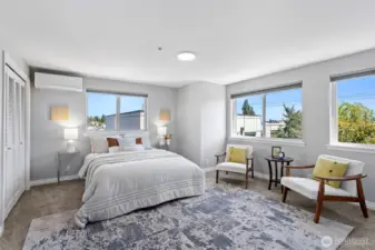 The primary bedroom is enormous with views of the mountains to the east, lots of windows and features modern cellular black out window shades.