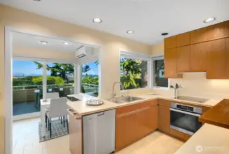 Kitchen has small eating area that leads to view deck with Mt Rainier views
