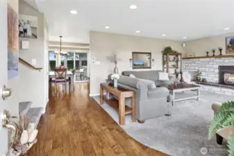 The moment you step inside, you’re welcomed by a bright and inviting living room centered around a cozy gas fireplace. Every detail of this home has been meticulously maintained, creating a warm and comfortable first impression.