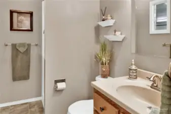 A convenient 3/4 bath is located just off the garage, perfect for guests or quick access from outside.