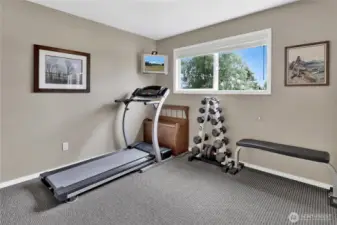 One of three upstairs bedrooms, this room faces south, filling the space with natural light.
