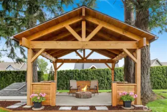 This exquisite gazebo is a showstopper, offering elegant shelter and serene shade—a perfect retreat for entertaining or unwinding in style.