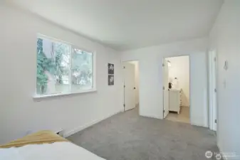 Primary walk in closet and full bath