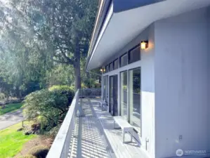 Looking out at wrap around deck from Primary Bedroom deck