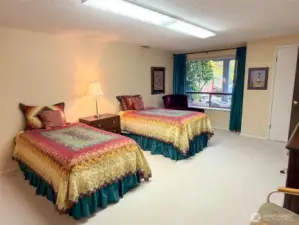 Lower level bedroom looking out to private space with separate entry