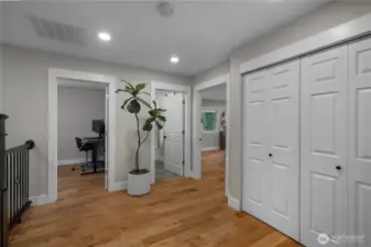 Closets take you to the washer and dryer with shelving builtin.