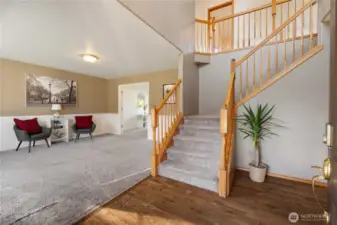 Enter to vaulted ceilings and realy hardwood floors.  This home offers lots of potential to make improvements and build value