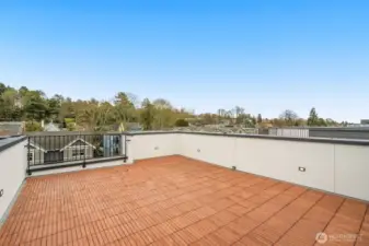 Your private urban oasis—a spacious rooftop deck designed for seamless outdoor entertaining