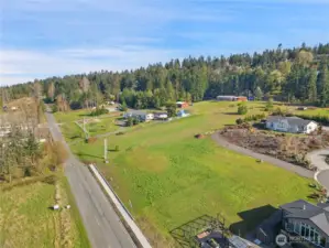 Aerial Southeast-facing view over Miller Rd., sidewalk and shared driveway.