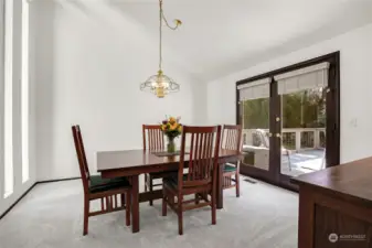 Formal dining room opens to deck.