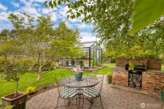 French doors off the kitchen lead you out to the back patio and serene water garden, which is off to the left.
