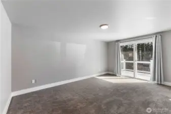 Second floor primary suite with access to a balcony overlooking the pool.