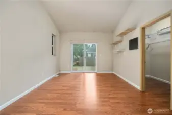 Primary bedroom has a slider to the backyard, large walk-in-closet, and 5-piece bath.